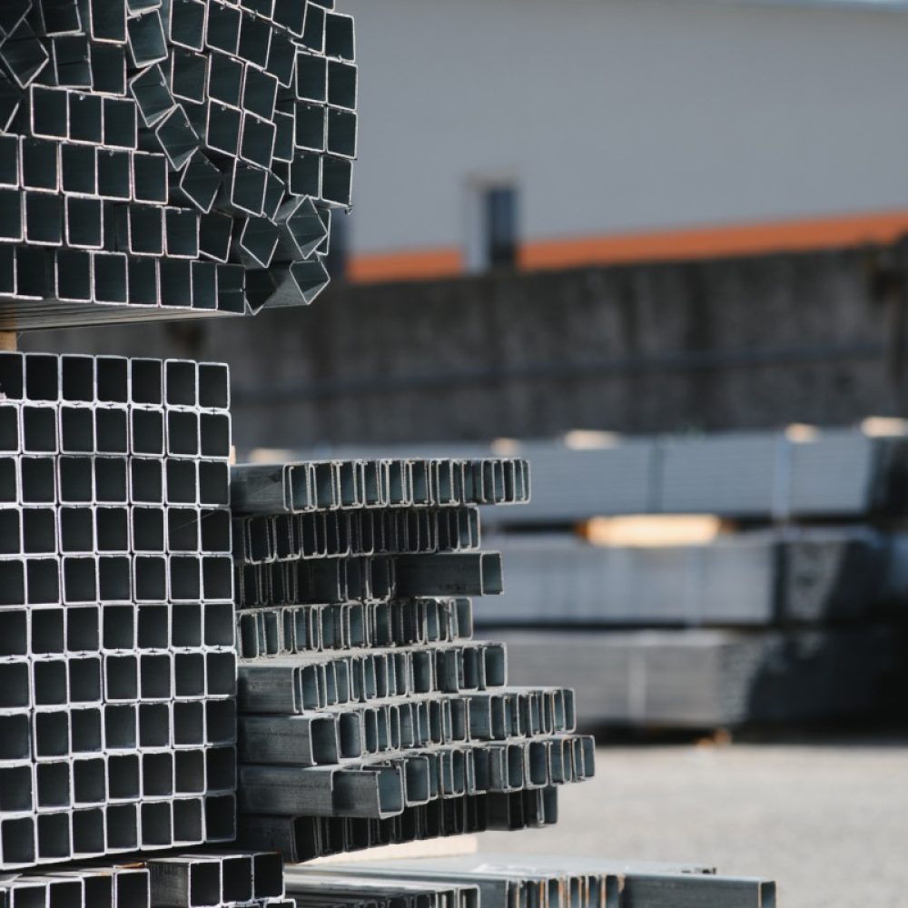 Stack of rolled metal products, perspective view of steel pipes of rectangular cross-section.